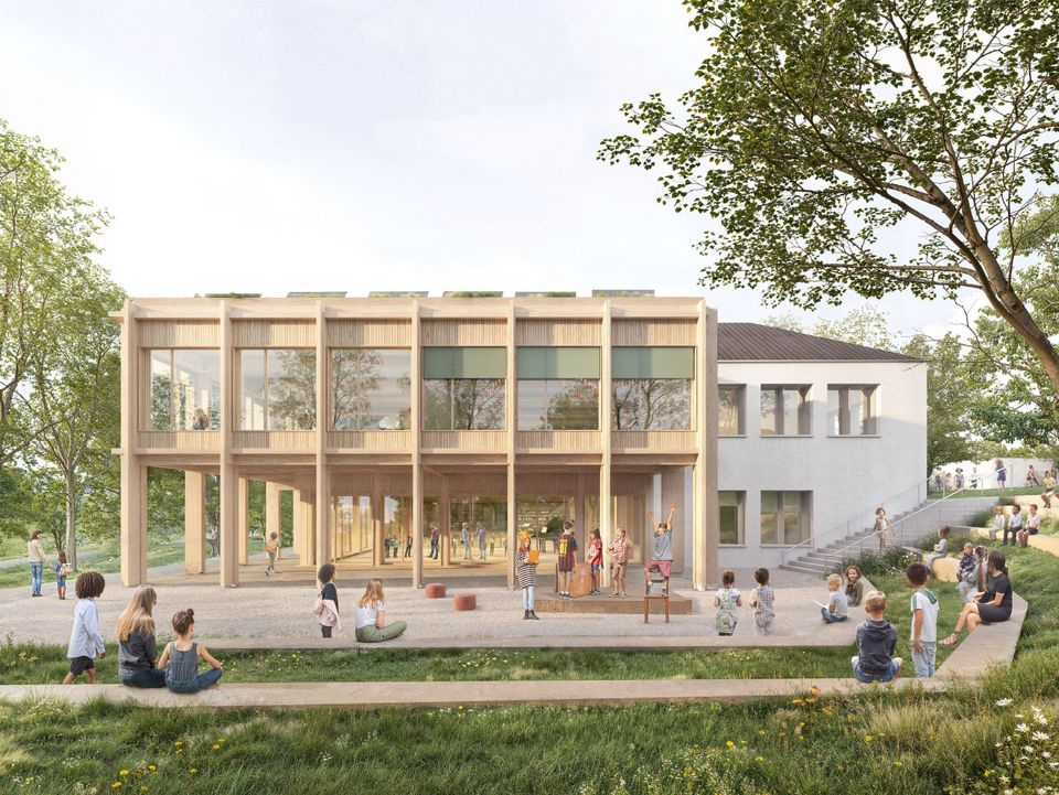 Exterior rendering of a school building with a timber façade, covered entrance area, extensive play spaces and surrounding green areas.